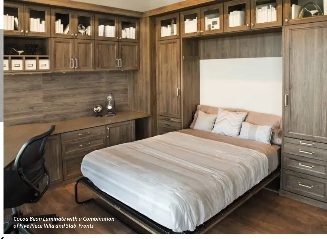 Murphy bed with surrounding cabinetry and a desk in a showroom display