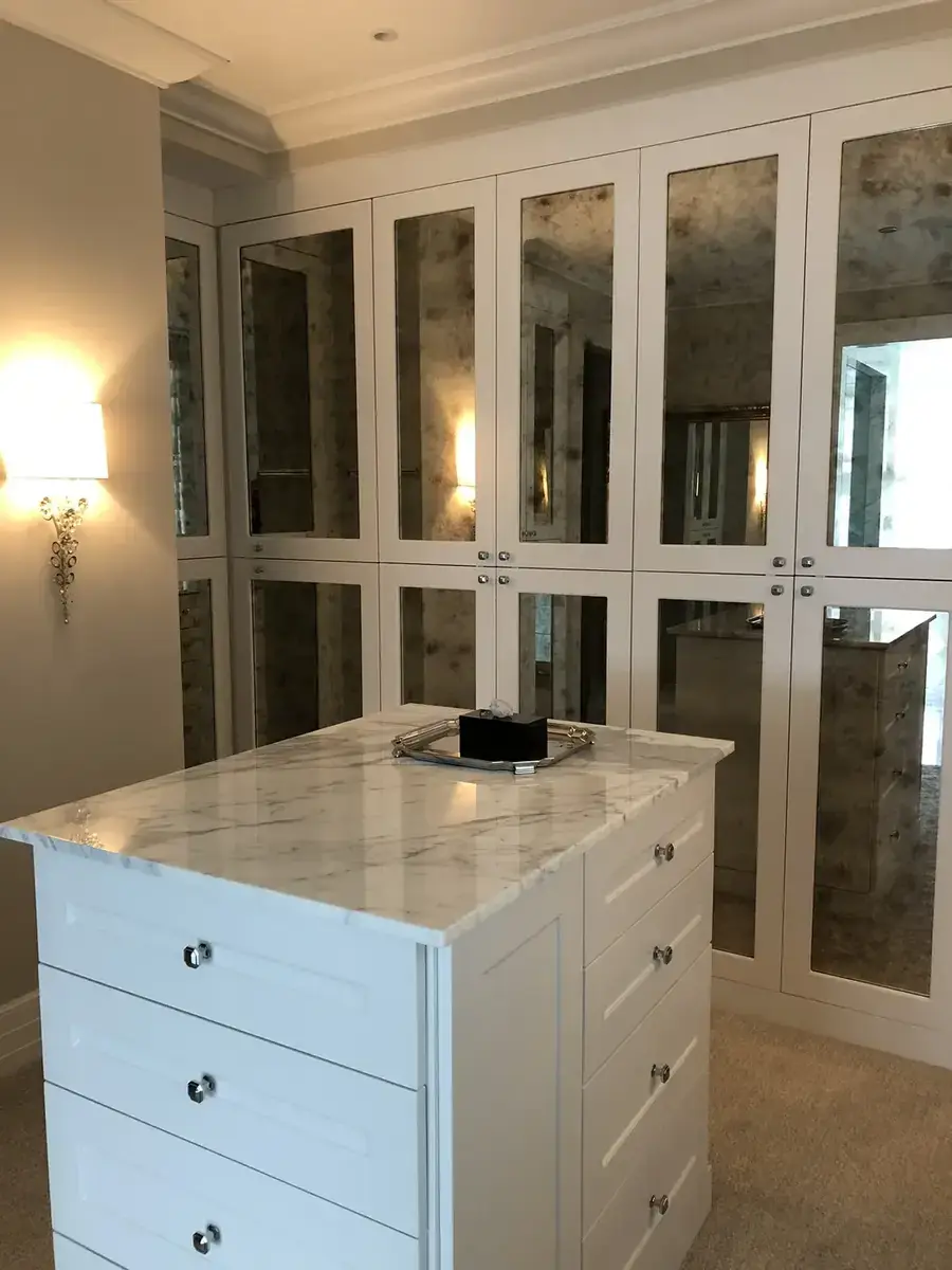 White Walk-In with Antique Mirror Doors & Marble Island